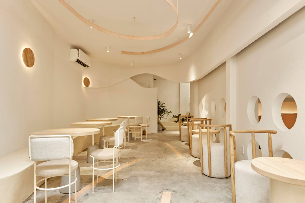 咖啡店风吹进了巢 越南 咖啡店 米色 白色 自然木色 洞穴 曲线 弧形 logo设计 vi设计 空间设计
